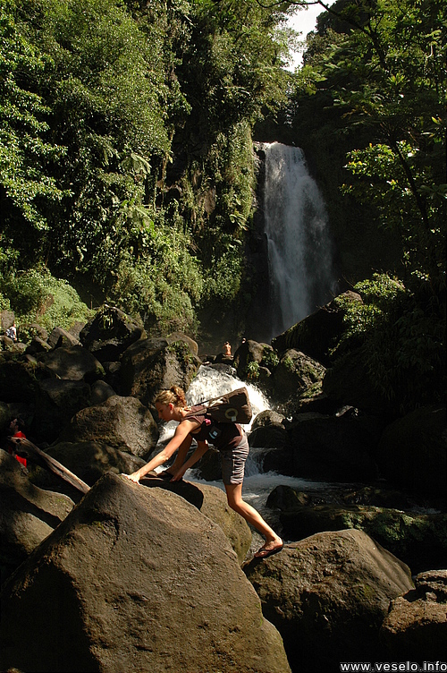 Photography. 145 people jump on last volcanic rocks to waterfall